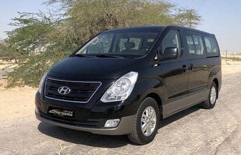 The front and side of a black van